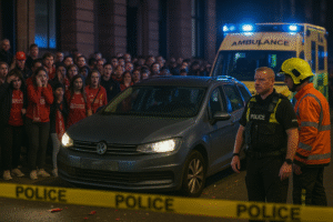 Police at scene of Liverpool parade car incident with ambulance and cordoned off area.
